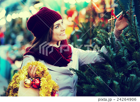 Woman choosing New Year's tree 24264906