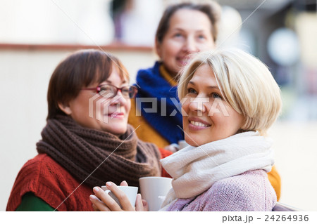 Women having tea on terrace Women having tea on terrace 24264936