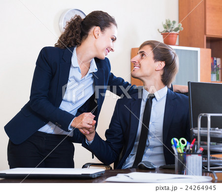 Top manager flirting with subordinate official at workplace Top manager flirting with subordinate official at workplace 24264945