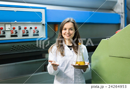 Portrait of female posing with olive oil containers 24264953