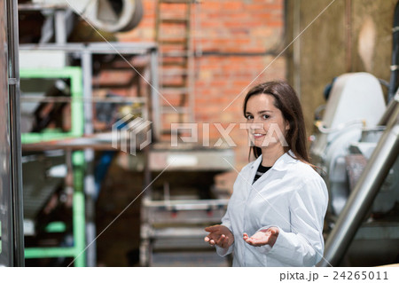 Smiling female engineer with olive devices Smiling female engineer with olive devices 24265011