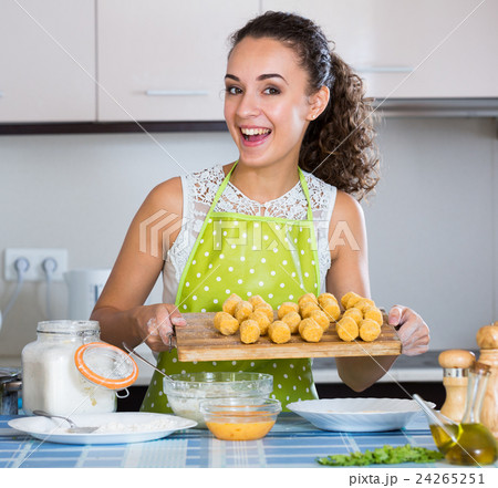 girl preparing croquettes for tasty dinner girl preparing croquettes for tasty dinner 24265251