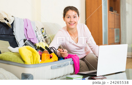 brunette packing luggage brunette packing luggage 24265538