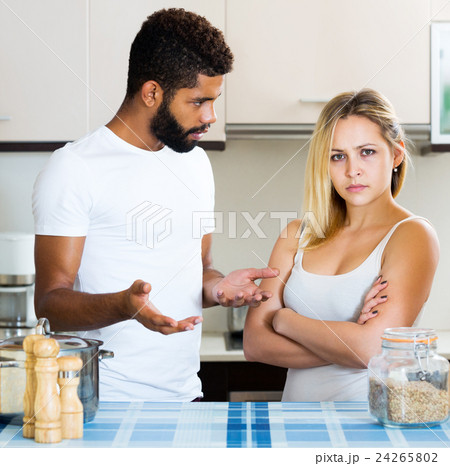 Afro guy and white girl quarrel 24265802