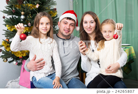 Happy family with Christmas tree 24265807
