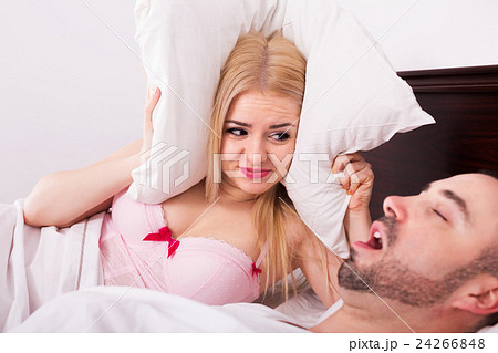 Unsleeping woman and snoring man Unsleeping woman and snoring man 24266848