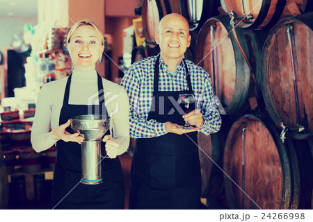 Portrait of two smiling wine makers taking wine Portrait of two smiling wine makers taking wine 24266998