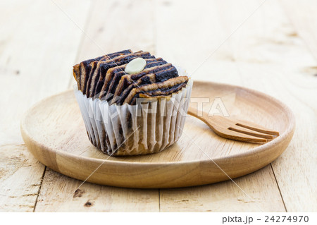 Chocolate flaky mini bread in the wooden plate. 24274970