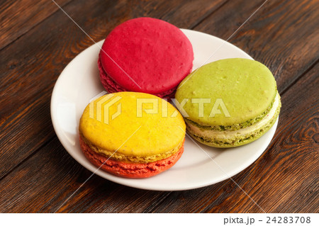 Three traditional french colorful macarons on 24283708