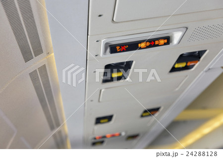 Service panel in passenger airplane closeup 24288128