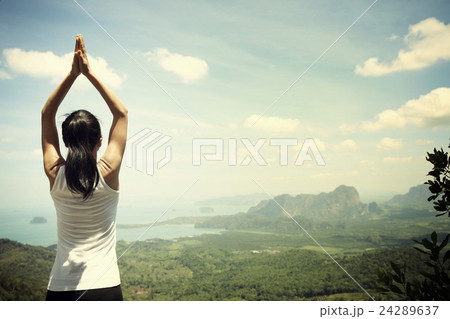 young fitness yoga woman at mountain peak 24289637