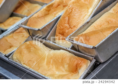 Close up various fresh baked buns/bread in market 24294342