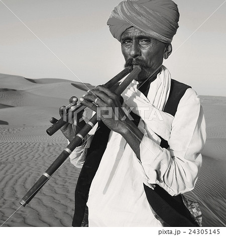 Indigenous Indian Man Playing Wind Pipe Desert Concept 24305145