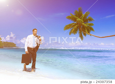 Businessman Walking Along the Tropical Beach 24307358