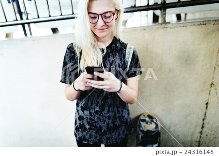 Young Woman Skater Browsing Phone Concept Young Woman Skater Browsing Phone Concept 24316148