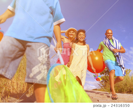 Cheerful Family Going to the Beach Cheerful Family Going to the Beach 24316350