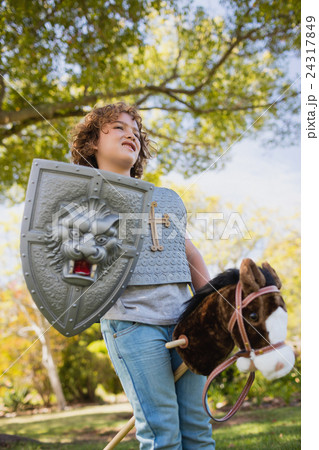 Cute boy pretending to be a knight 24317849