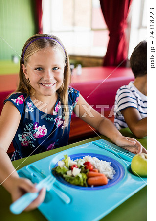 Child eating at the canteen 24318223