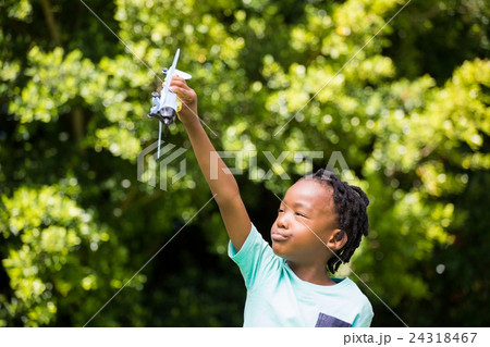 Boy playing with a toy plane 24318467