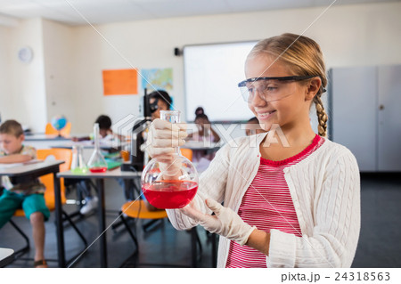 A cute pupil posing with beaker A cute pupil posing with beaker 24318563