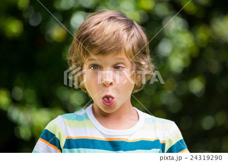A little boy is making a funny face 24319290