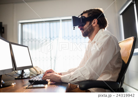 Businessman wearing virtual glasses 24319942