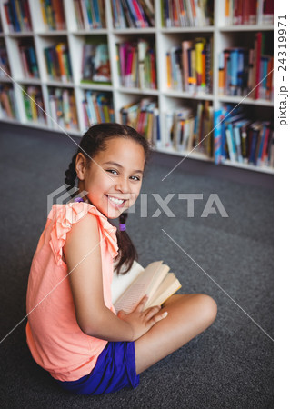 Little girl reading a book 24319971