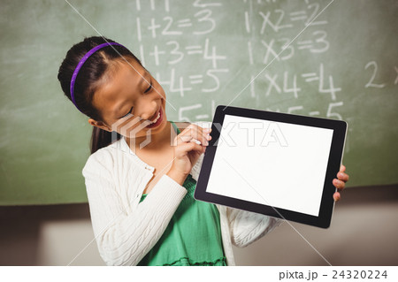 Girl holding a tablet Girl holding a tablet 24320224