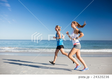 Friends jogging at the beach Friends jogging at the beach 24320236