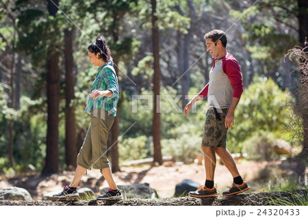 Couple smiling and walking with balance Couple smiling and walking with balance 24320433