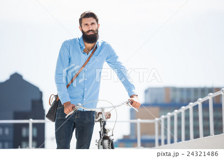 Hipster walking his bike Hipster walking his bike 24321486