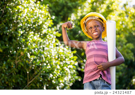 Boy is wearinf a hardhat 24321487