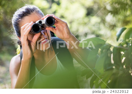 Woman looking something with binoculars 24322012