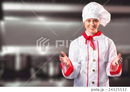 Composite image of pretty chef standing with hands out 24325532
