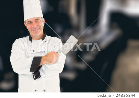 Composite image of man in chef uniform holding meat cleaver Composite image of man in chef uniform holding meat cleaver 24325844
