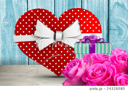 Composite image of heart shaped box of candy 24326080