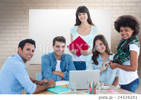 Composite image of smiling casual colleagues in a meeting 24326201