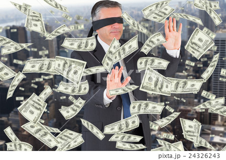 Composite image of mature businessman in a blindfold 24326243