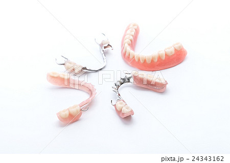 Set of dentures on white background Set of dentures on white background 24343162