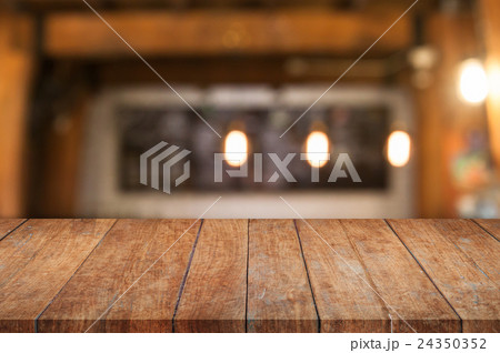 Brown wooden table top with coffee shop Brown wooden table top with coffee shop 24350352