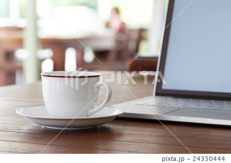 Cup of coffee and laptop Cup of coffee and laptop 24350444