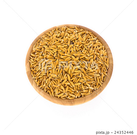 Paddy in a wooden bowl on white background 24352446