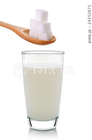 glass of milk with sugar on a white background glass of milk with sugar on a white background 24352671