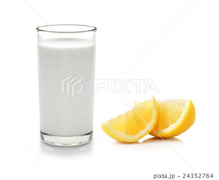 Glass of milk and Half lemon fruit Glass of milk and Half lemon fruit 24352764