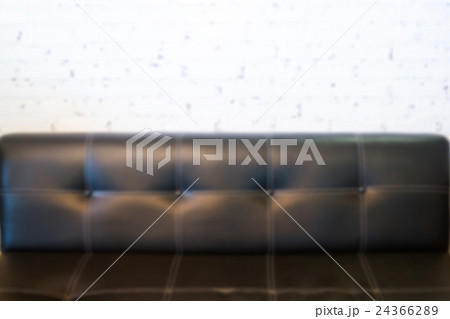 Room interior white brick wall with black sofa 24366289
