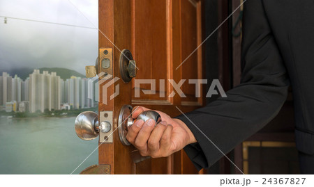 businessman open the door to new world 24367827