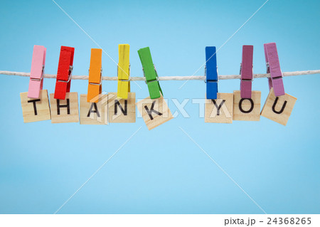Colorful pegs with THANK YOU note against blue bac Colorful pegs with THANK YOU note against blue bac 24368265
