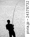 Silhouette of Man Fighting Fish in Rain 24378732