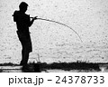 Silhouette of Man Fighting Fish in Rain 24378733