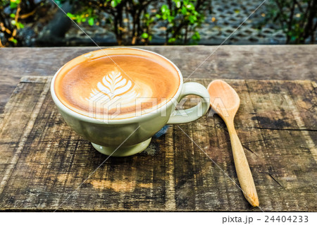 Latte Art Coffee Mug on Wooden Table Latte Art Coffee Mug on Wooden Table 24404233